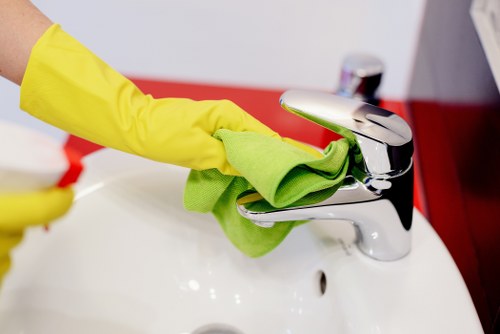 Upholstery cleaning process on a fabric sofa in a living room