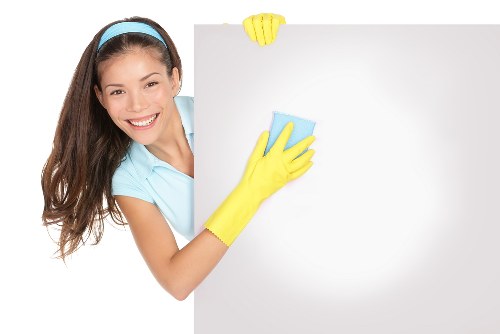 Vacuuming a mattress to remove dust and allergens